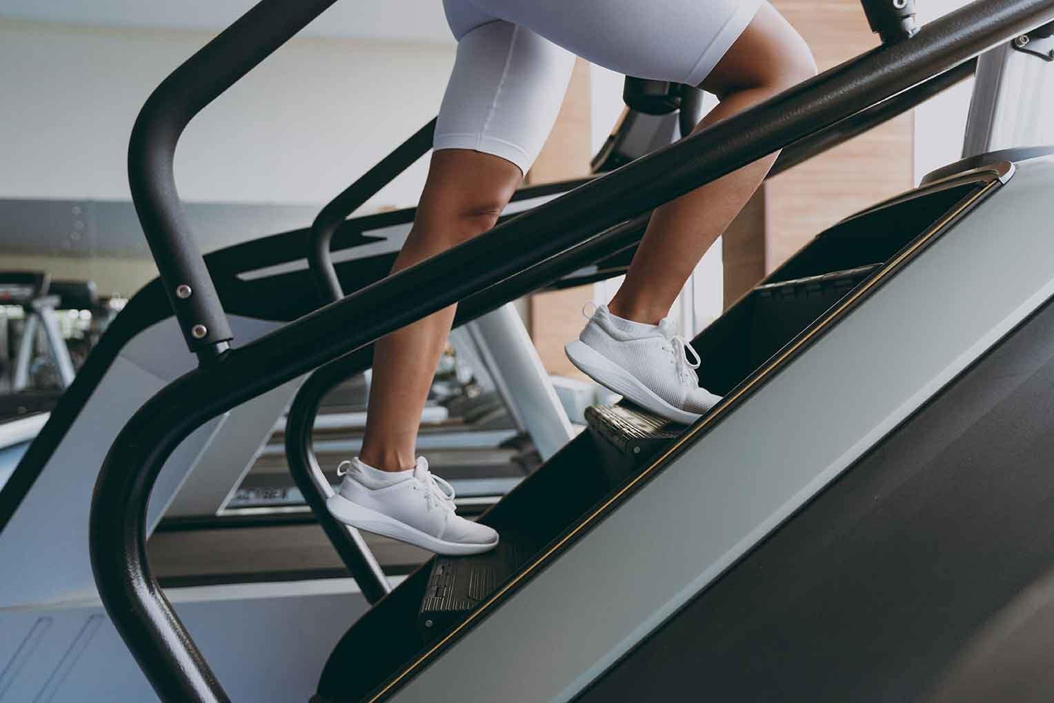 person climbing stepmill