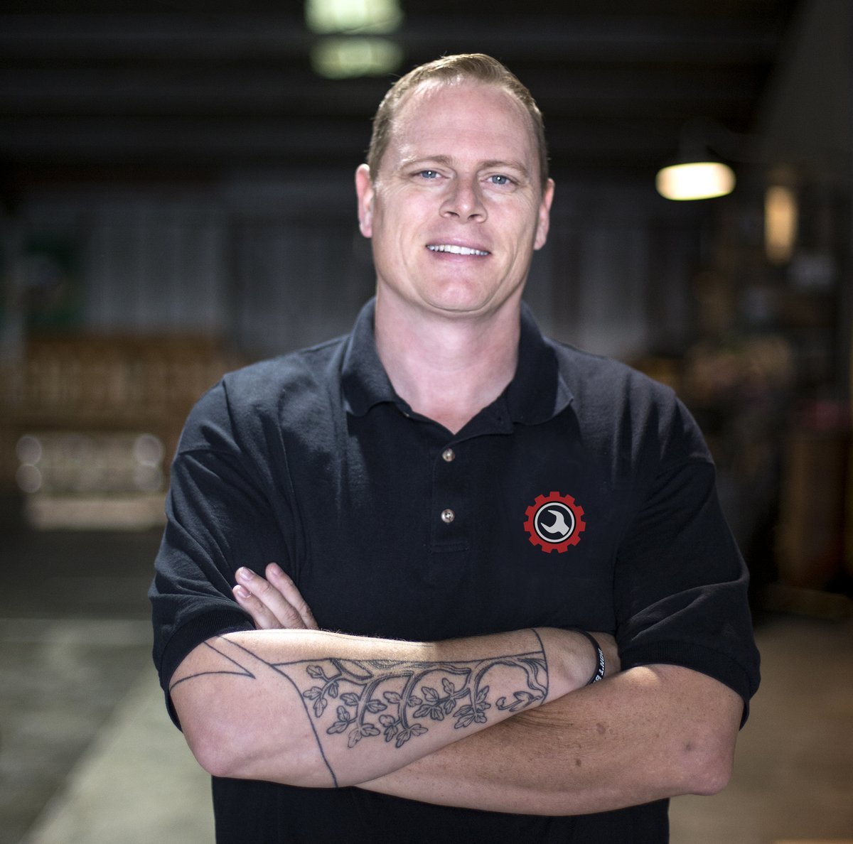 Scott Jennings, founder and CEO of ServiceRX, standing in the warehouse with arms crossed